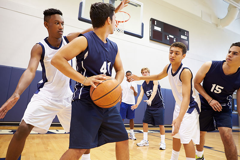 high school kids playing basketball